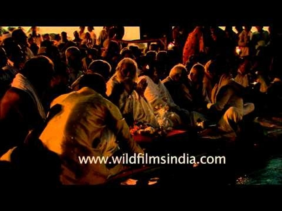 Devotees performing evening worship at Maha Kumbh site, Allahabad