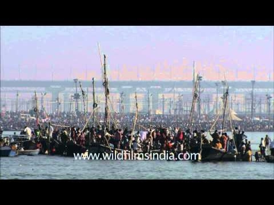 Devotees in boats as they gather at Sangam for taking baths during Maha Kumbh