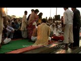 Holy crowd performing rituals on the banks of Allahbad during maha Kumbh