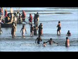 Devotees taking holy dip in Ganga during Maha Shivratri at Maha Kumbh