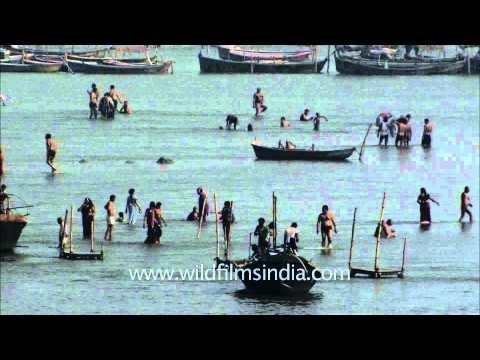 Devotees paying obeisance and taking holy dip in Sangam during Maha Kumbh