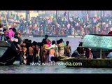 Devotees taking holy dip at Sangam, Prayag during Maha Kumbh