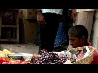 Young Indian fruit seller - Child Labor ruins lives