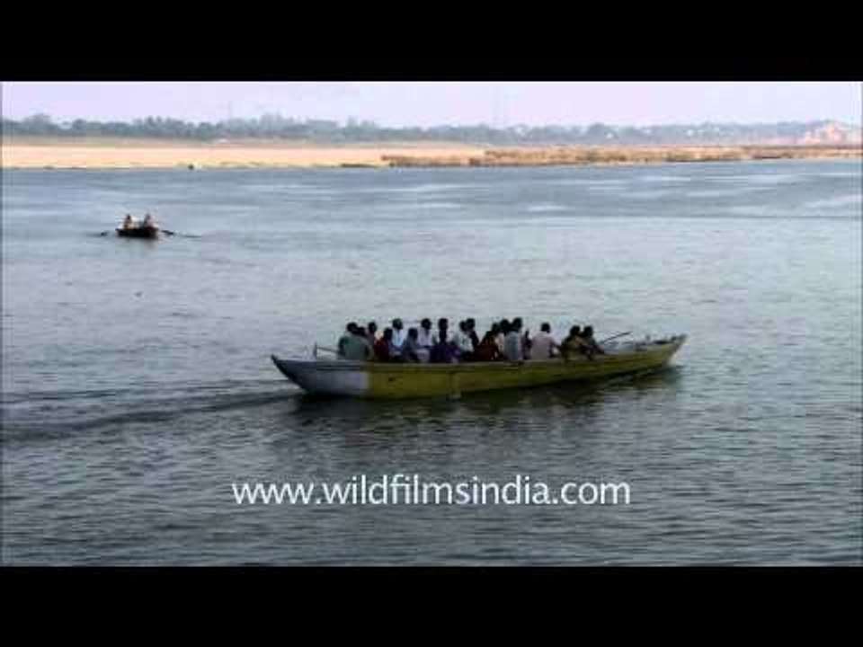 Devotees enjoy boating at Varanasi ghat