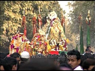 Muslim devotees holding Tazia during Muharram