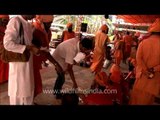 Devotees offering money to Sadhus at Samashti Bhandara during Maha Shivratri