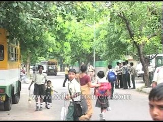 An auto-rickshaw overloaded with students
