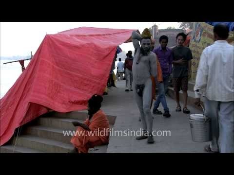 A young sadhu with his face and body smeared with ash at Varanasi