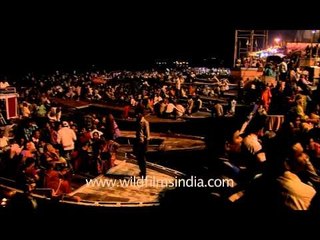 Devotees listening to devotional song on Varanasi ghat