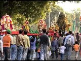 Muslim devotees holding Tazia on their shoulders during Muharram