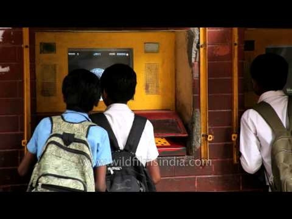 Boys log into computers installed at Sheikh Sarai, New Delhi by Hole-in-the-Wall Education Ltd