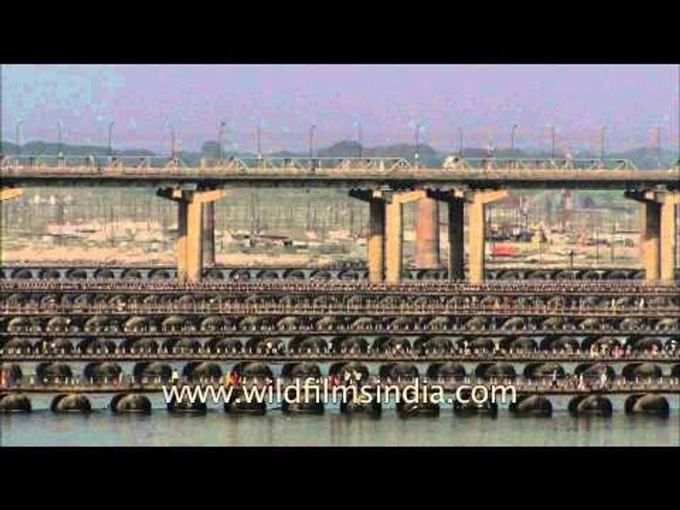 Millions of Devotees crossing pontoon bridges o...