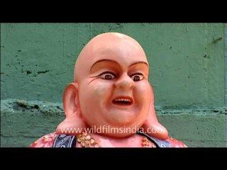 Colourful statue of laughing Buddha at Children's Park of Mathur, Tamilnadu