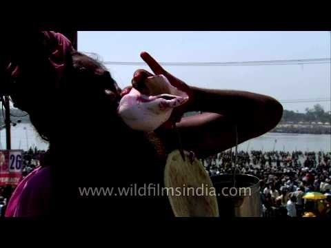 Lord Shiva's devotee performing shankh ritual during Maha Shivratri at Maha Kumbh, Allahabad