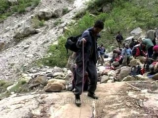 Nanda Devi Expedition members prepares to cross a dangerous stream