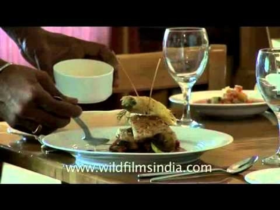 Chefs at hotel Claridges plating the dessert