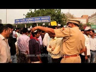 Protesters gather outside AIIMS Hospital where Masoom is being treated