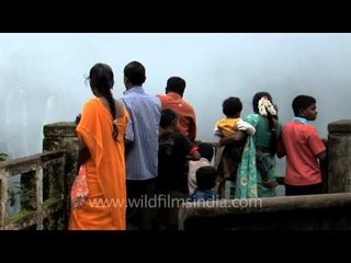 Visitors gawk at Jog Falls from hill-top ledge!