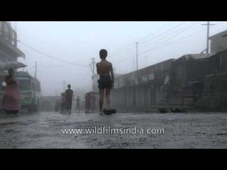 Cherrapunji - Children playing a game of football in the rain