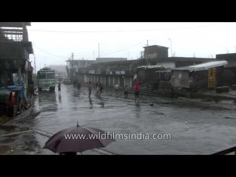 Boys enjoy football on rain drenched streets in Cherrapunji