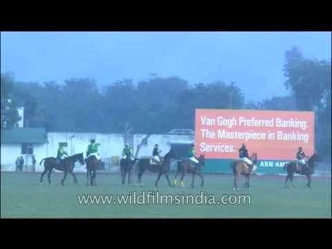 Eyes on the ball and hands firmly holding reins Players chase the Ball