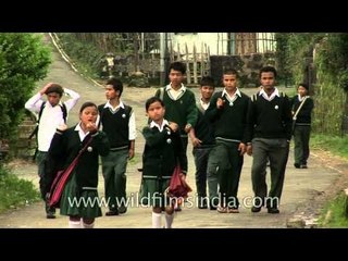 School kids in Cherrapunji carry their quintessential umbrellas