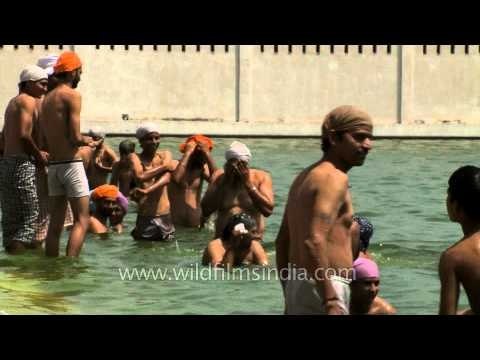 Sikh devotees taking holy dip during Vaisakhi at Gurudwara Takht Sri Kesgarh Sahib, Punjab