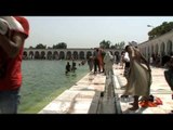 Devotees taking a holy dip on Baisakhi at the sarovar in Gurudwara Takht Sri Kesgarh Sahib