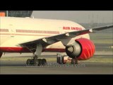 Air India Boeing plane is towed off runway, Delhi airport