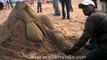 Sculpting out of sand in Puri Beach, Odisha