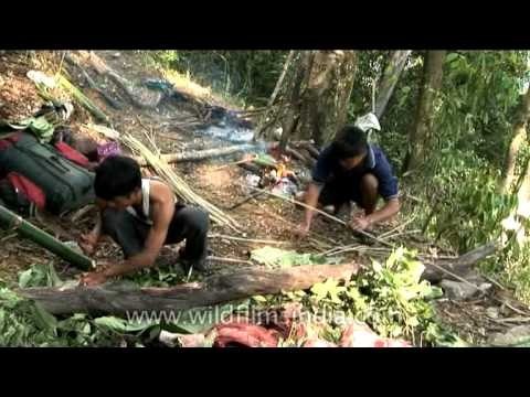 Hunters weaving a basket in jungles of Arunachal Pradesh