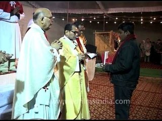 People at Midnight Mass on Christmas in Delhi