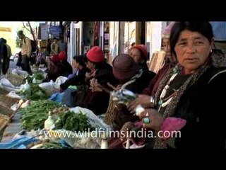 Ladakhi women in full regalia selling organic vegetables