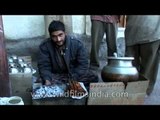 Vendor selling famous street food Rista-gushtaba of Kashmir