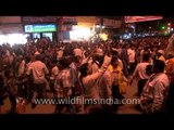 Elephant walking along a crowded thoroughfare at the Maha Shivratri procession