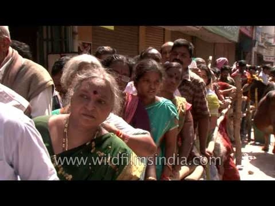 Enthusiastic Lord Shiva devotees forming serpentine queues outside a Temple, Varanasi