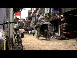 Protest rally and cycle rickshaw on Kathmandu streets