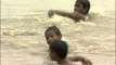 Kids splashing around in the waters of Yamuna River, Delhi