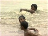 Kids splashing around in the waters of Yamuna River, Delhi