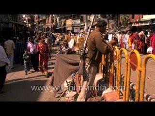 Beggars making makeshift tent at a traffic divider in Varanasi
