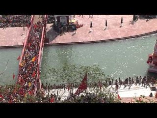 Devotees crossing bridge during Kumbh at Haridwar