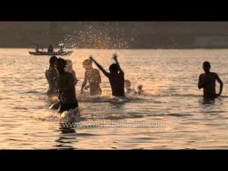 Fun games for young boys in river Ganga, Varanasi
