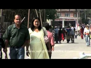 Nepali flower sellers chasing people to buy their product