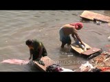 Varanasi ghat is used for bathing and washing clothes!