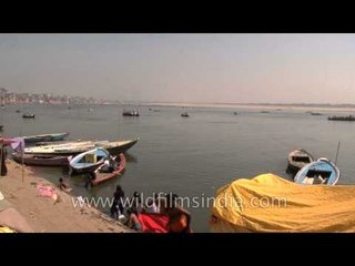 Spiritual dip and boat ferrying in river Ganga at Varanasi