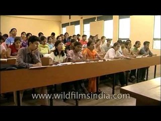 Attending lecture at Sri Venkateswara College