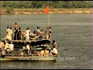 Ferry boat - barge carrying cyclists across the Yamuna River in Delhi