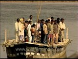 Villagers cross Yamuna river in rickety old makeshift boat