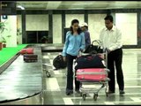 Claiming baggage from carousel at Chhatrapati Shivaji International Airport