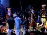 Masked dancers performing at the week - long ritual Padayani festival